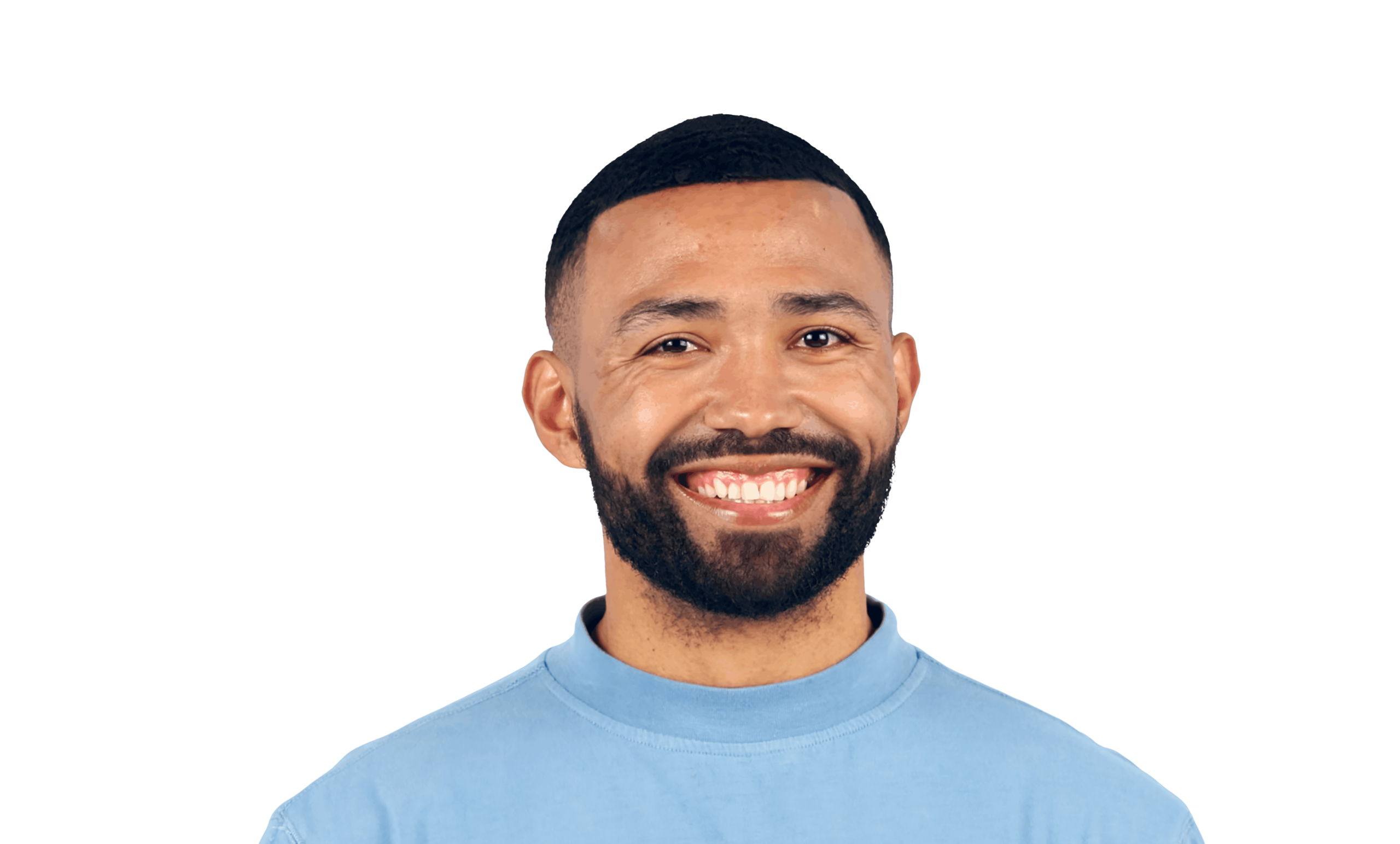 Close-up portrait of a smiling man with a beard, wearing a light blue turtleneck shirt, against a white background.