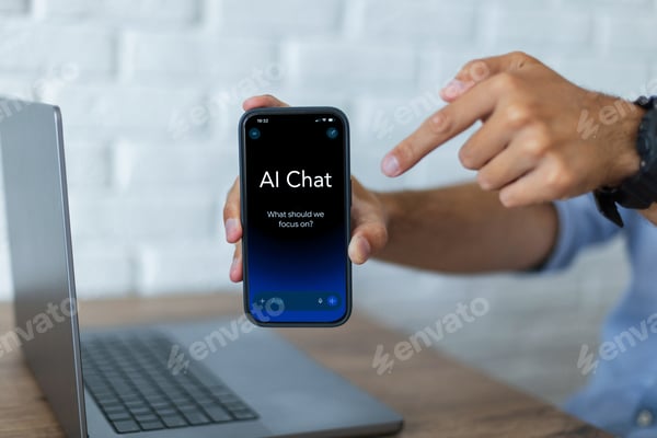 Close-up of a man holding a smartphone showing an AI chat application with a prompt on screen